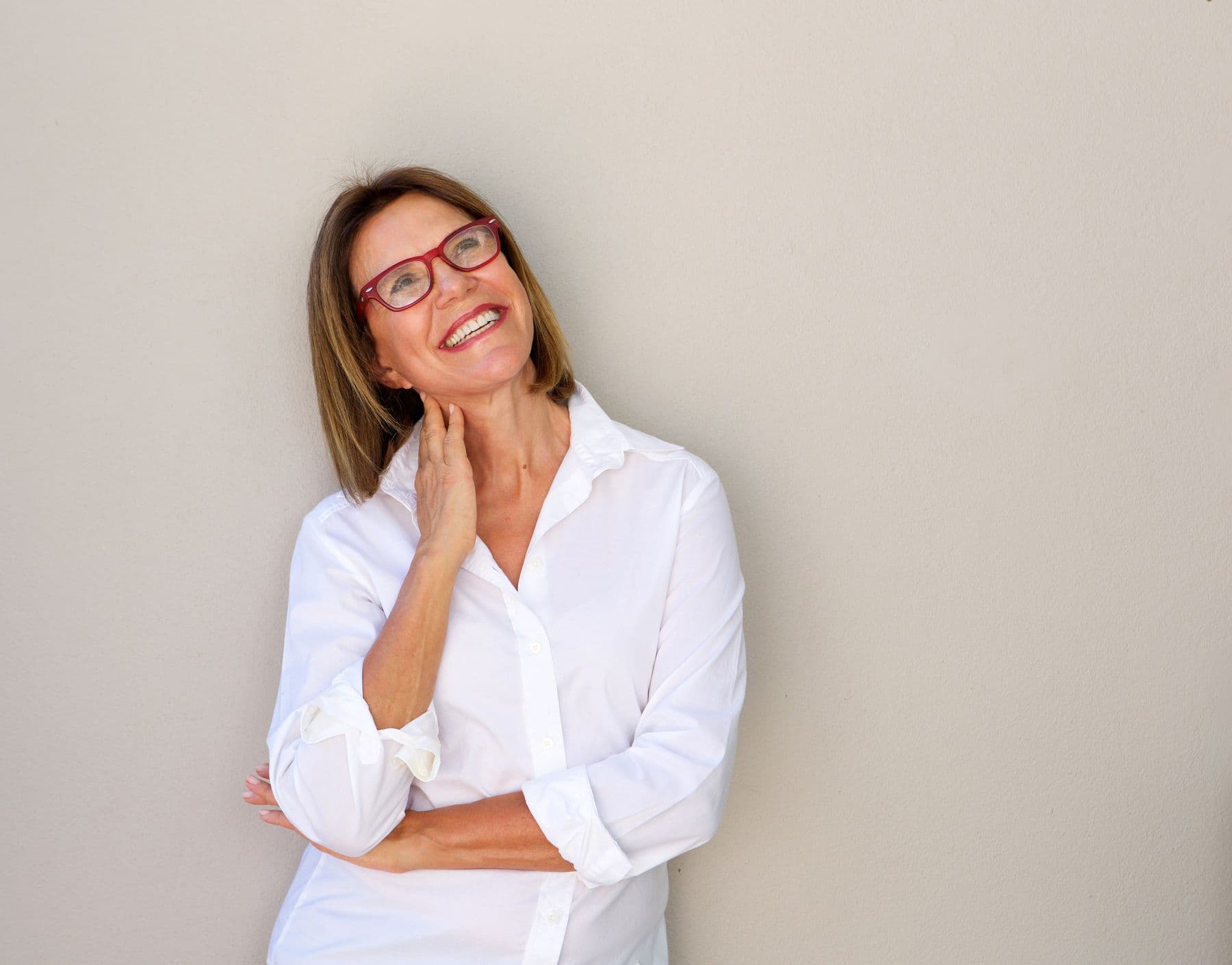 Woman smiling, looking up
