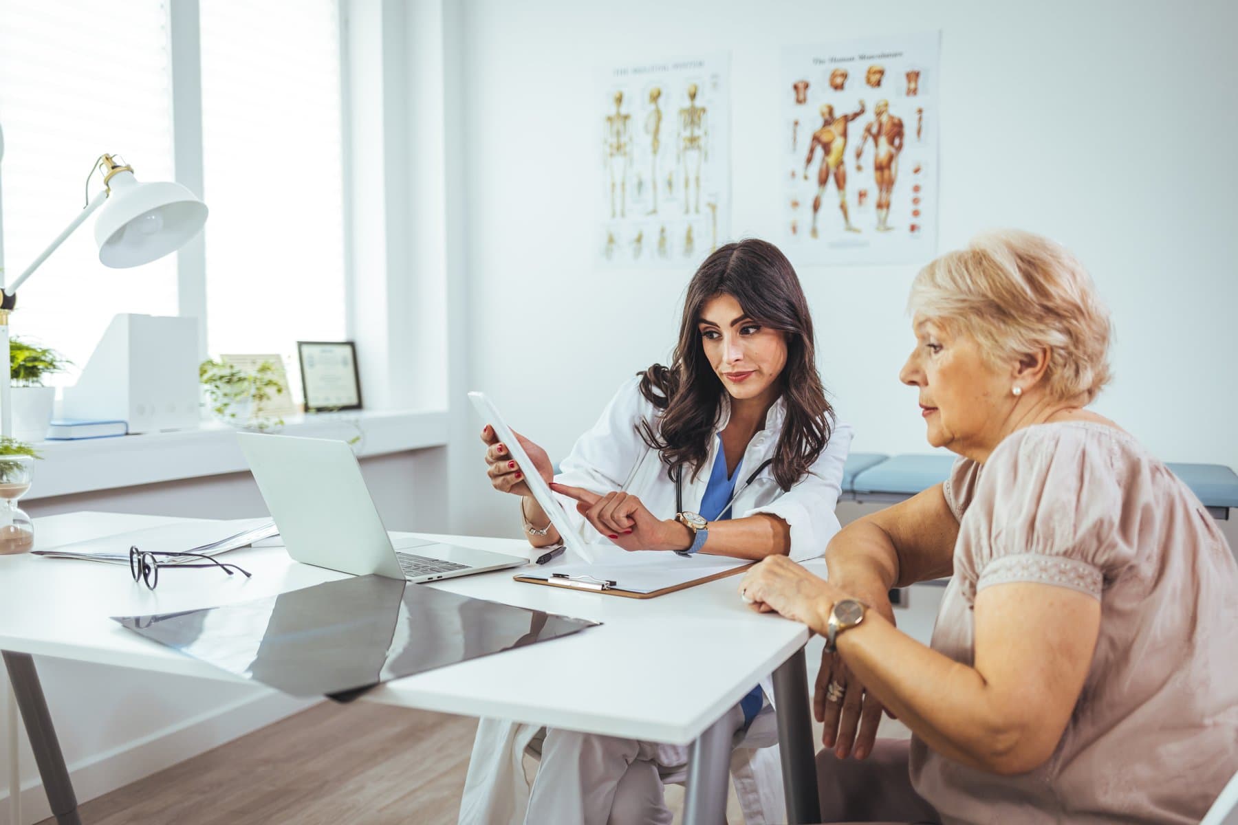 Woman prepared with questions at a breast augmentation consultation